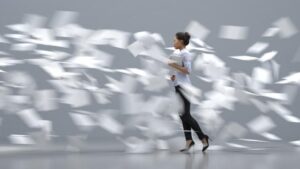 lady with papers flying around