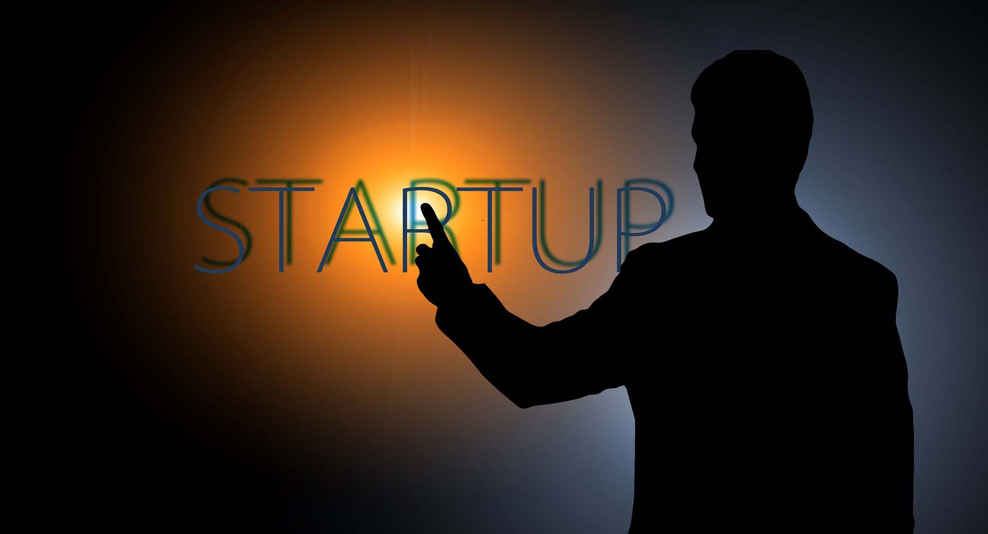 Man showing the word startup