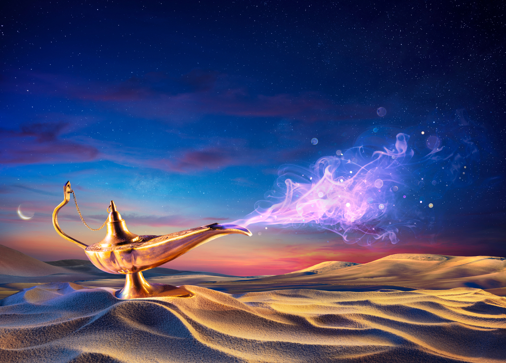 A colorful lamp in the desert with a genie coming out of it