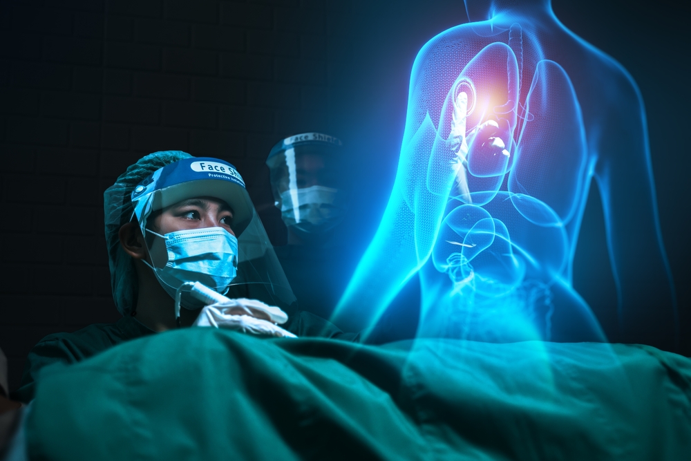 A surgeon looking at a human hologram