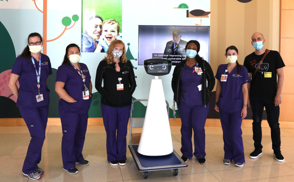 : nurses standing with Robin, Emotional Support Robot Source: newsroom.ucla.edu