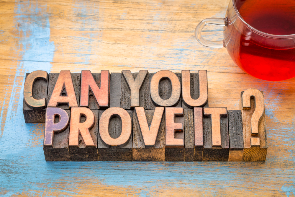 Can you prove it? A question in vintage letterpress wood type with a cup of tea.